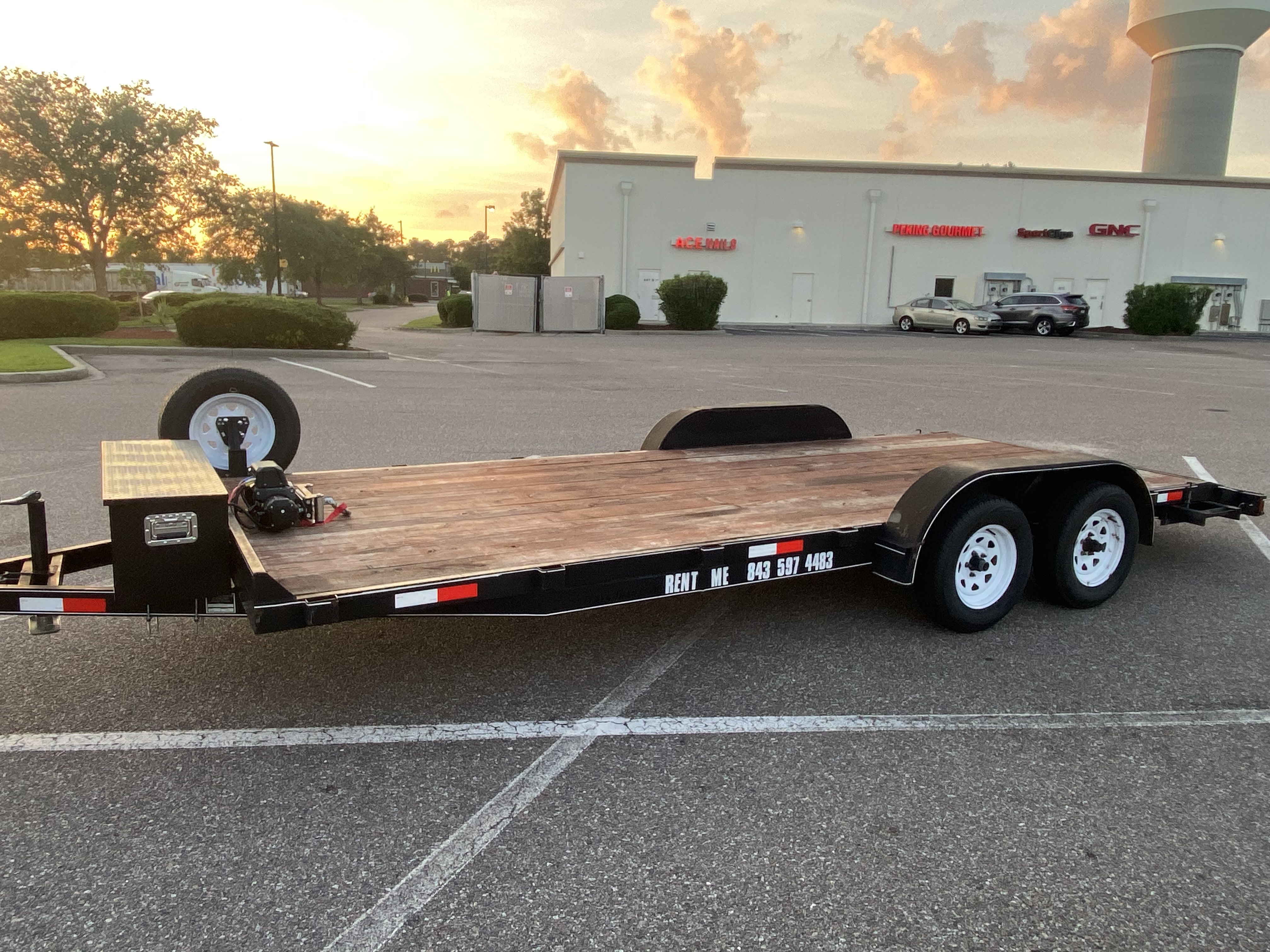 Car hauler towing a vehicle