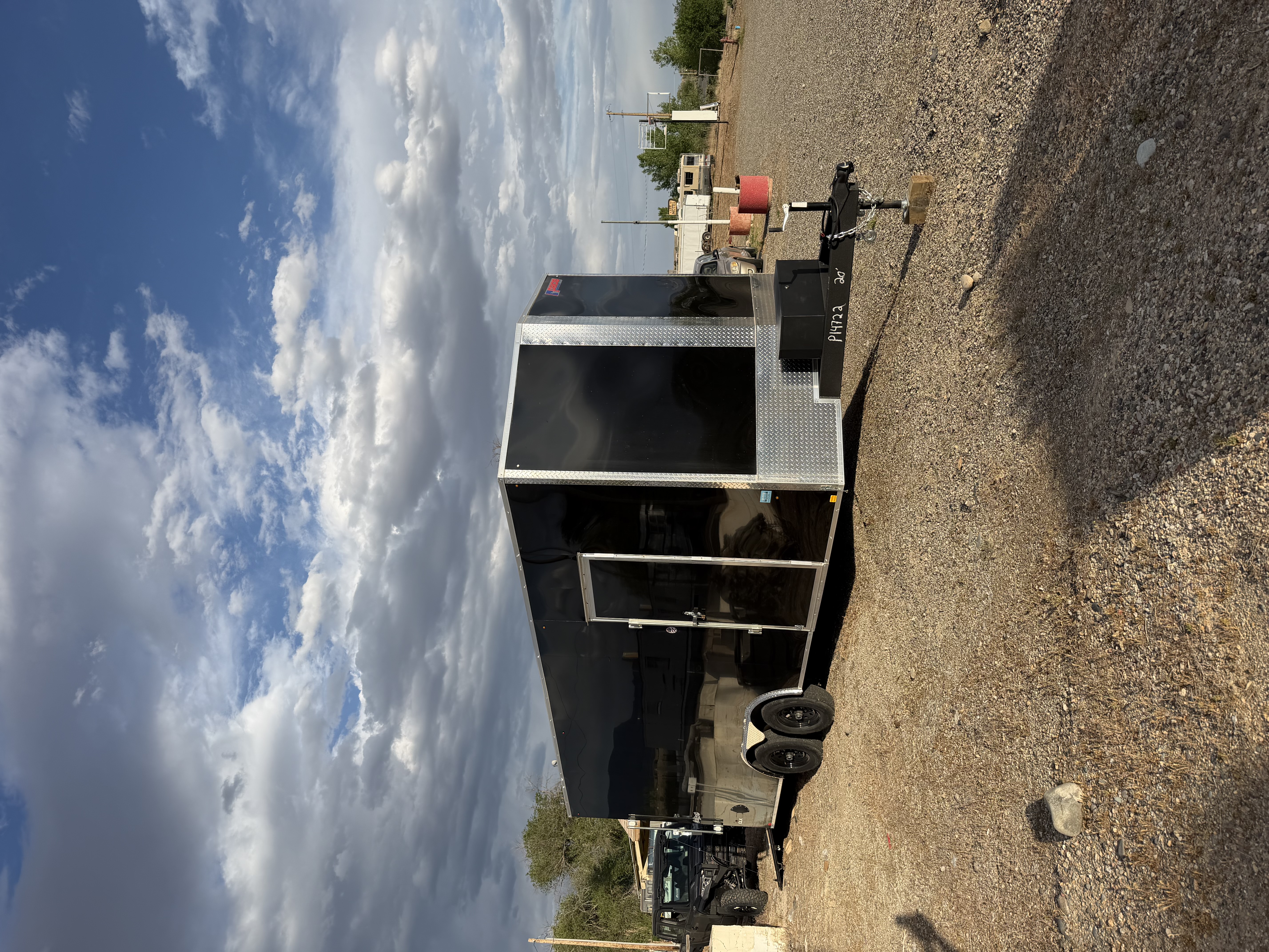 Enclosed cargo trailer and gooseneck dump trailer available for rent in Whitewater, Colorado