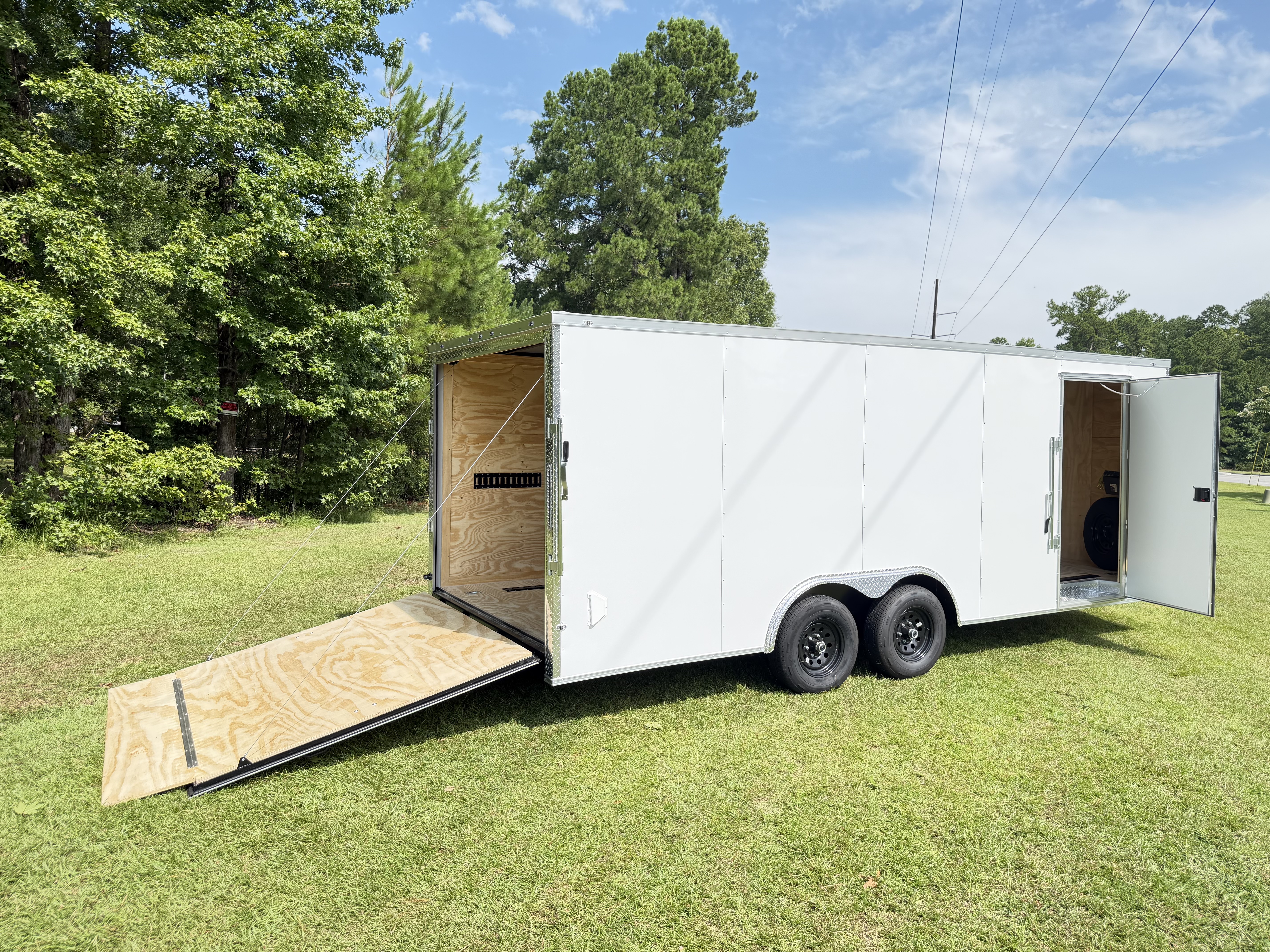 Enclosed trailer rear ramp door